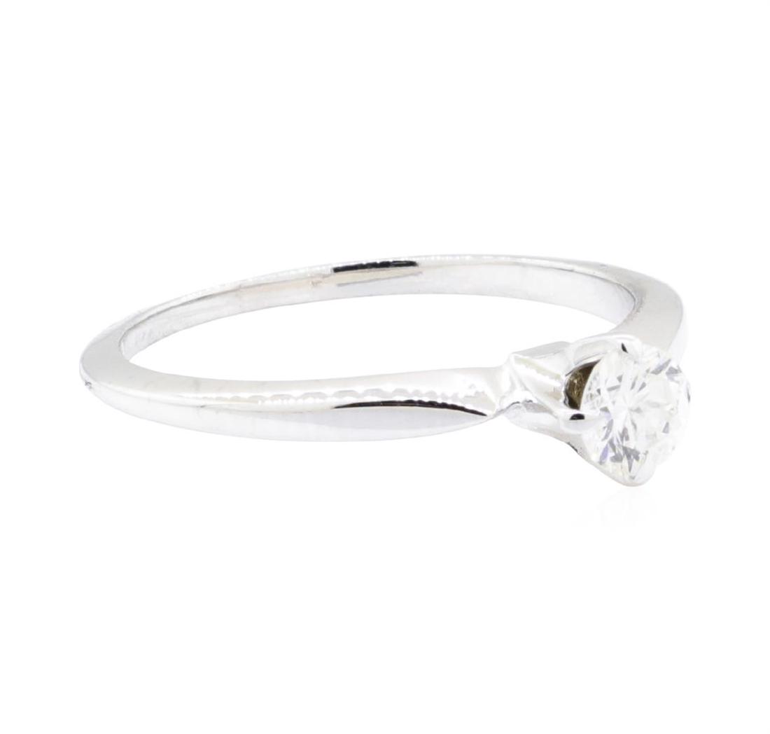 18KT White Gold 0.32 ctw Diamond Ring: One electronically tested 18KT white gold lady's cast solitaire ring with a bright polish finish. The featured lady's ring has a shank measuring 1.15 millimeters wide. Identified with markings of '18K