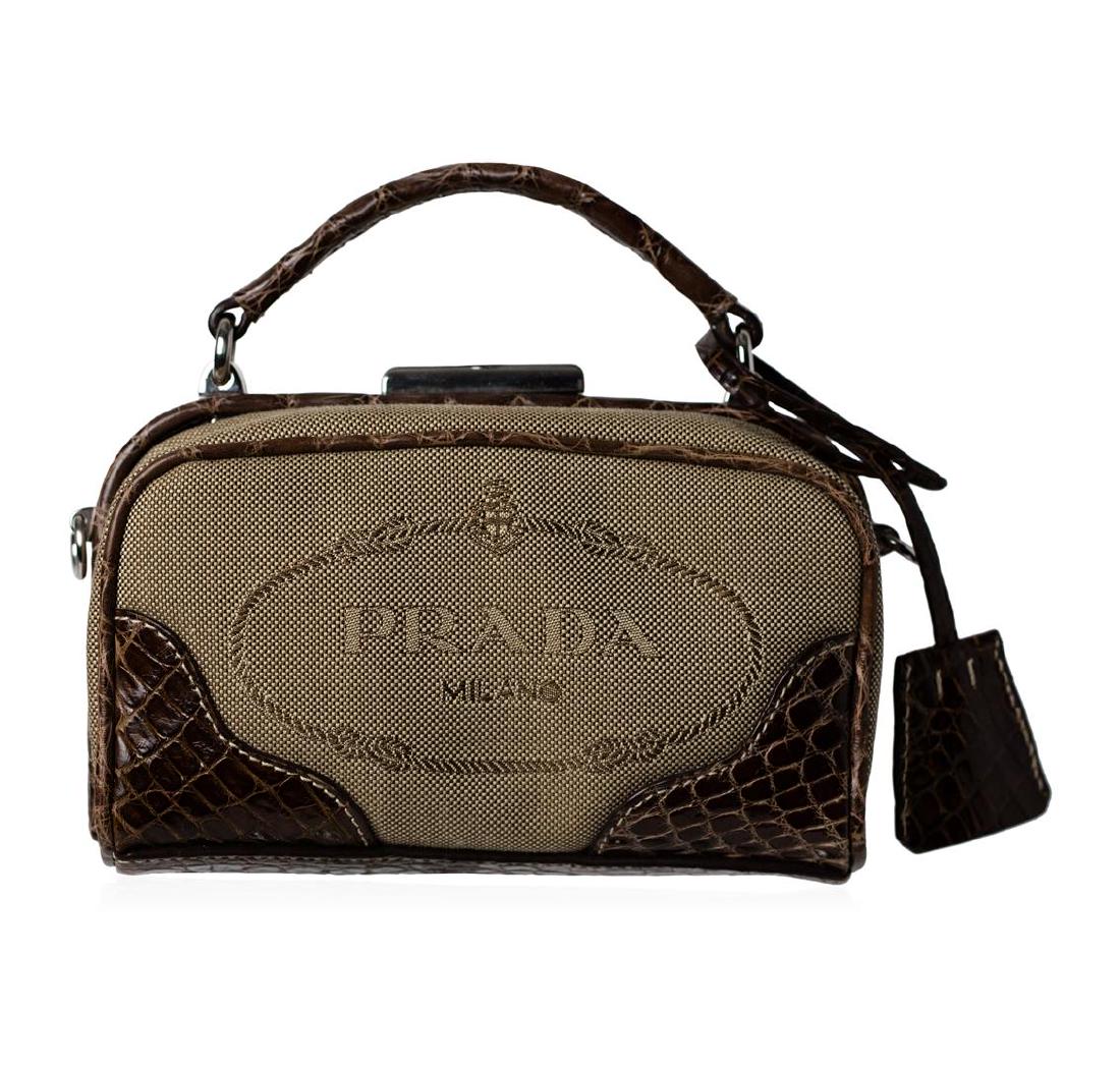 Prada Logo Jacquard Mini Crossbody Clutch Bag: This authentic mini Prada bag is perfect for a night on the town. It features brown jacquard material with "Prada Milano" inside their iconic rope design front and center. Framing the bag in it's enti