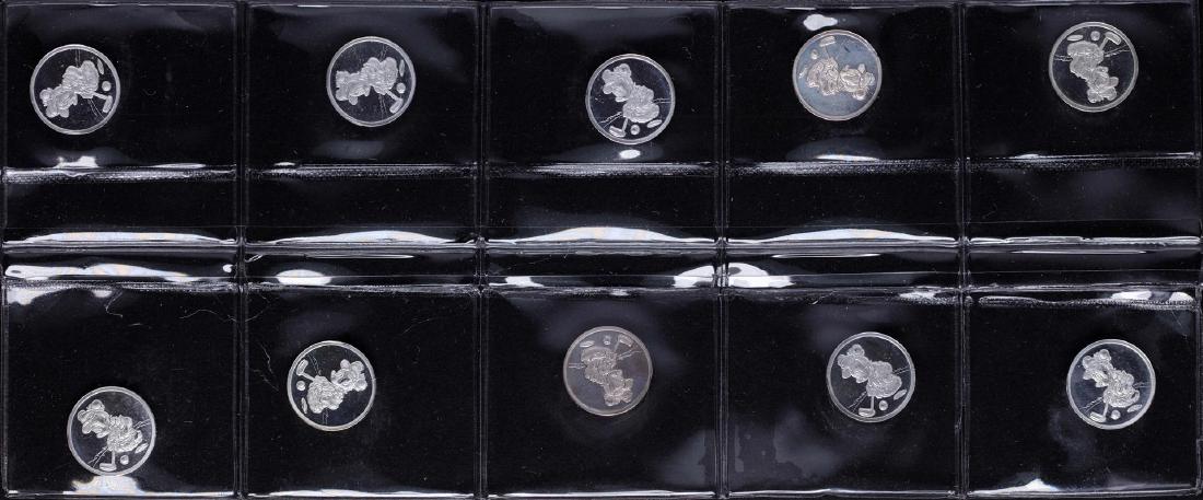 Lot of (10) Disney Mickey & Minnie Mouse Golfer 1/20: One Lot of (10) Disney Mickey & Minnie Mouse Golfer 1/20 oz. .999 Fine Silver Coin Rounds.