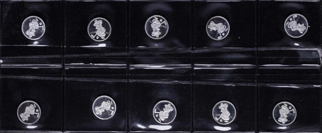 Lot of (10) Disney Mickey & Minnie Mouse Golfer 1/20: One Lot of (10) Disney Mickey Mouse 1/20 oz. .999 Fine Silver Coin Rounds.
