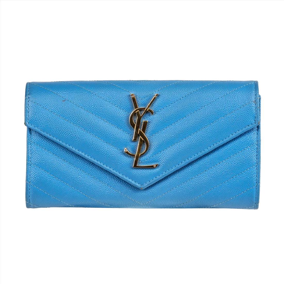 Saint Laurent Large Monogram Flap Wallet in Powder Blue: 100% Large Monogram Saint Laurent Flap Wallet in Powder Blue Grain De Poudre textured Calfskin Leather featuring central gold-toned, metal interlocking YSL buckle and Matelassé (chevron) stitching. S