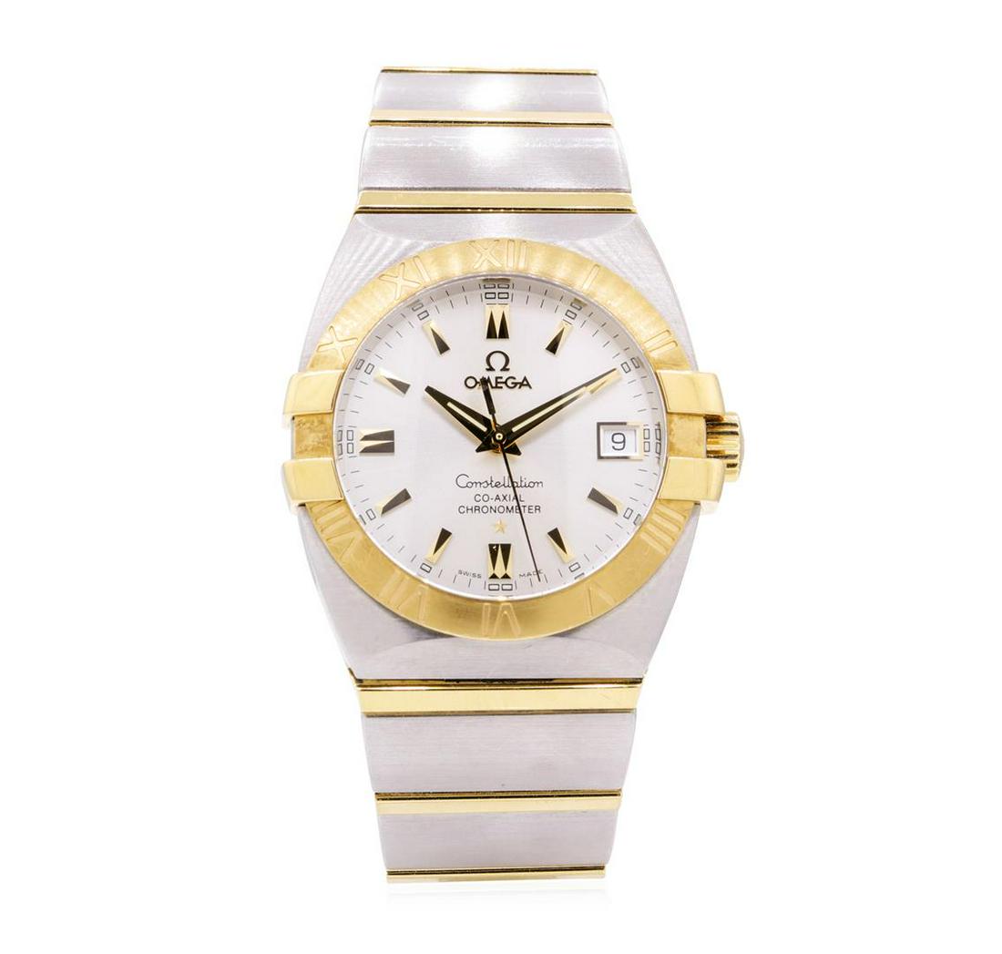 Omega Mens Constellation Stainless Steel and 18KT: One man's, hand crafted and machine milled Omega round case Constellation wrist watch electronically tested 18KT gold and stainless steel, Serial#: 80749260, Crown: pull out, Bezel: gold roman numeral