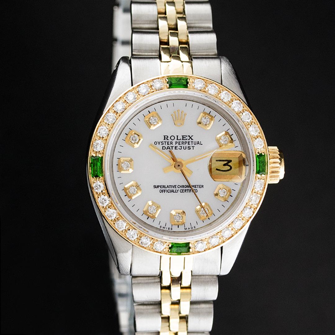 Rolex Ladies Two Tone MOP Diamond & Emerald Datejust: One Ladies 14K Two Tone Rolex Datejust Polished, Serviced & Electronically Tested, 14K Yellow Gold & Stainless Steel Case: 26mm, 14K Yellow Gold Crown, Custom Bezel: New 18K Yellow Gold Emerald Beadse