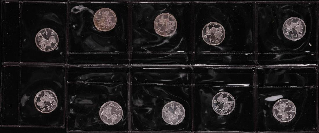 Lot of (10) Disney Mickey & Minnie Mouse Golfer 1/20: One Lot of (10) Disney Mickey & Minnie Mouse Golfer 1/20 oz. .999 Fine Silver Coin Rounds.