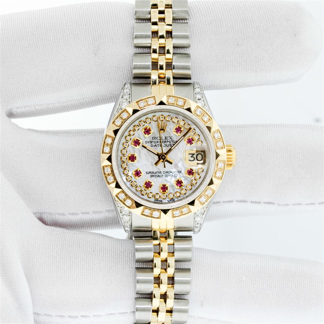 Rolex Ladies Two Tone Steel & Gold MOP Ruby & Diamond: One Ladies Two Tone Rolex Datejust Polished, Serviced & Electronically Tested, Yellow Gold & Stainless Steel Case: 26mm, Yellow Gold Crown, Diamond Lugs: 24 Diamonds On Lugs, Clarity: SI-VS, Color: G