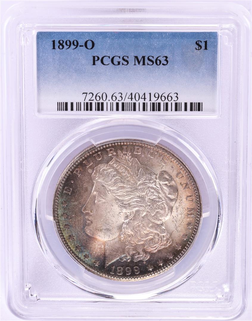 1899-O $1 Morgan Silver Dollar Coin PCGS MS63 Nice: One 1899-O $1 Morgan Silver Dollar Coin PCGS MS63 Nice Toning. PCGS Graded.
