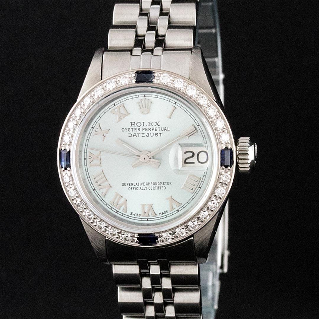 Rolex Ladies Stainless Steel Diamond & Sapphire Oyster: One Ladies Stainless Steel Rolex Datejust Polished Bright with Satin Finish, Serviced & Electronically Tested, Stainless Steel Case: 26mm, Stainless Steel Crown, Custom Bezel: New 18K White Gold Sapph