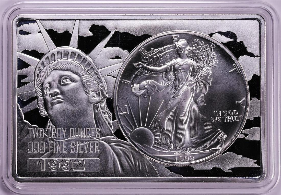 1992 $1 American Silver Eagle Coin & 2oz Silver Bar Set: One 1992 $1 American Silver Eagle Coin & 2oz Silver Bar Set.