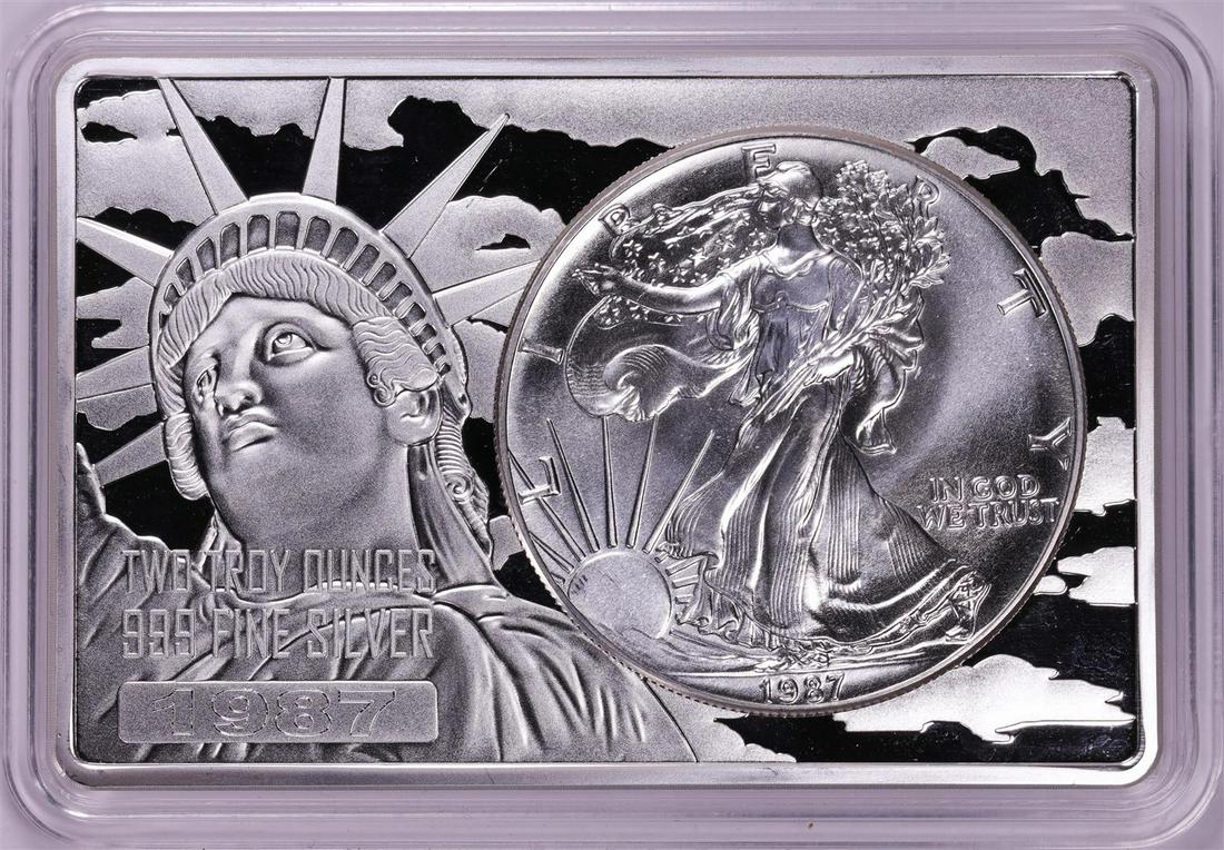 1987 $1 American Silver Eagle Coin & 2oz Silver Bar Set: One 1987 $1 American Silver Eagle Coin & 2oz Silver Bar Set.