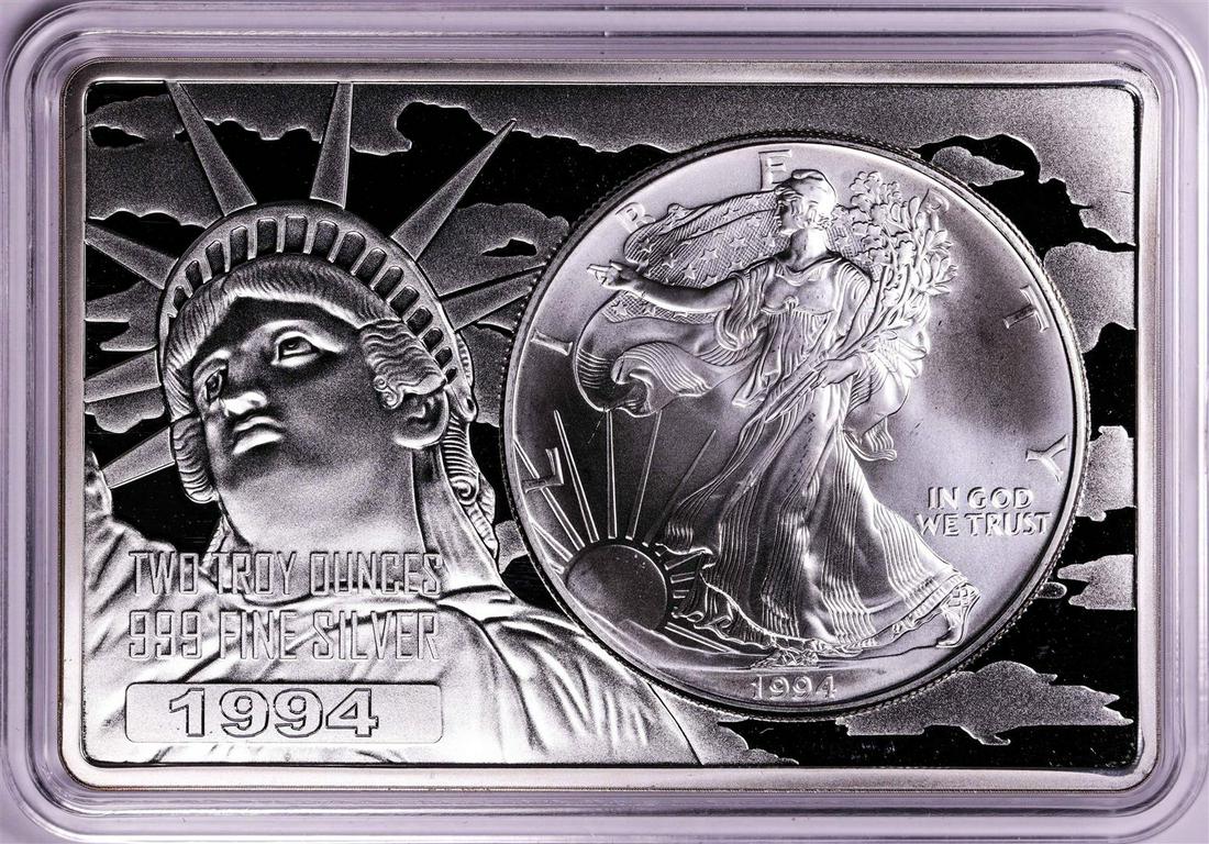 1994 $1 American Silver Eagle Coin & 2oz Silver Bar Set: One 1994 $1 American Silver Eagle Coin & 2oz Silver Bar Set.