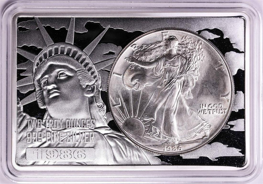 1986 $1 American Silver Eagle Coin & 2oz Silver Bar Set: One 1986 $1 American Silver Eagle Coin & 2oz Silver Bar Set.