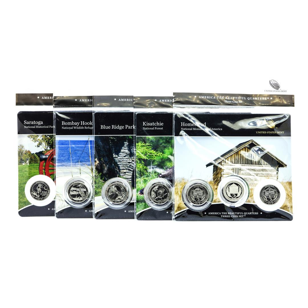 Lot of (5) 2015 America The Beautiful Three-Coin Quarter Sets: Lot of (5) 2015 America The Beautiful Three-Coin Quarter Sets, including (1) three coin set from each of the following:.