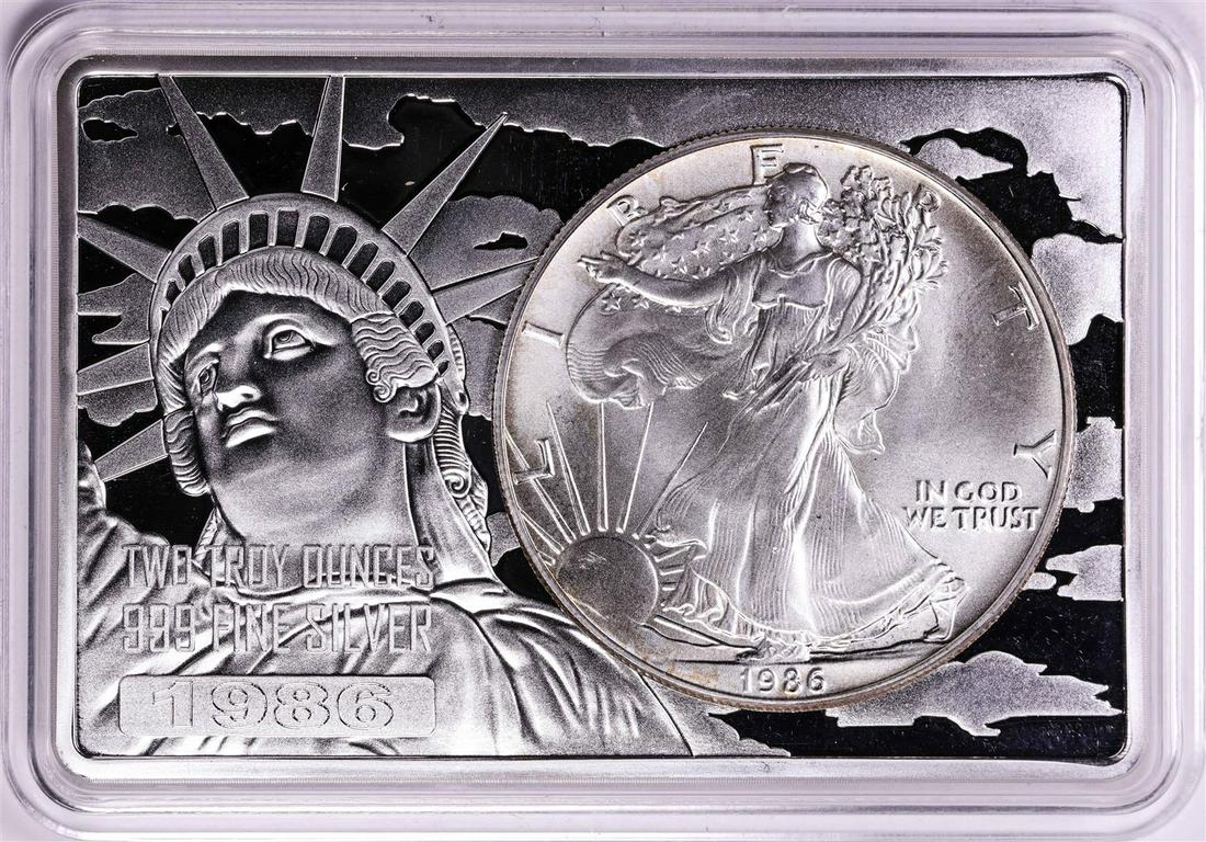 1986 $1 American Silver Eagle Coin & 2oz Silver Bar Set: One 1986 $1 American Silver Eagle Coin & 2oz Silver Bar Set.