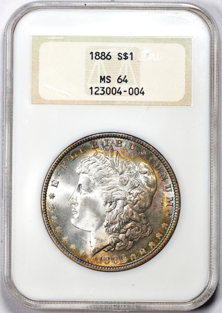 1886 $1 Morgan Silver Dollar Coin NGC MS64 Amazing Toning Old Fatty Holder: One 1886 $1 Morgan Silver Dollar Coin NGC MS64 Amazing Toning Old Fatty Holder. NGC Certified.
