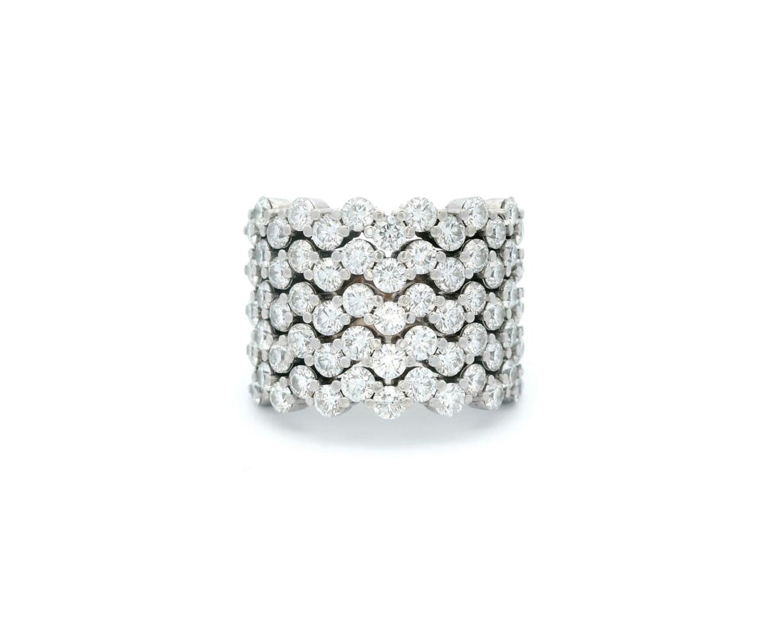 18KT White Gold 4.21 ctw Diamond Band Ring: One electronically tested 18KT white gold lady's cast fashion wide band ring with a 5 row zig-zag motif with a bright polish finish. Condition is new, good workmanship. The featured lady's ring has a 
