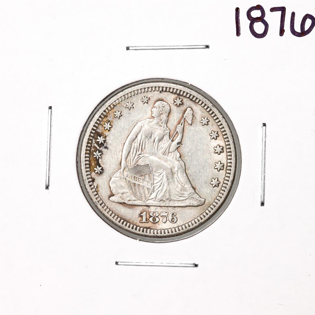 23) 1876 Seated Liberty Quarter Coin: One 1876 Seated Liberty Quarter Coin.