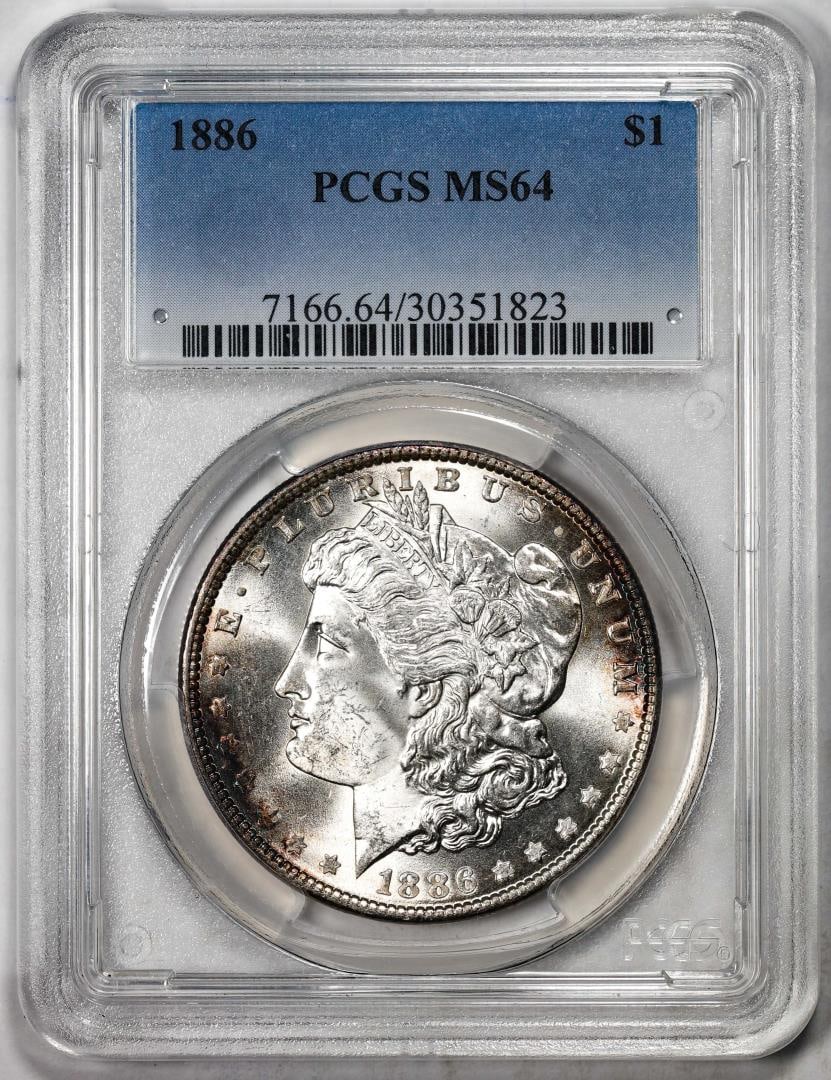 61) 1886 $1 Morgan Silver Dollar Coin PCGS MS64: One 1886 $1 Morgan Silver Dollar Coin PCGS MS64. PCGS Graded.