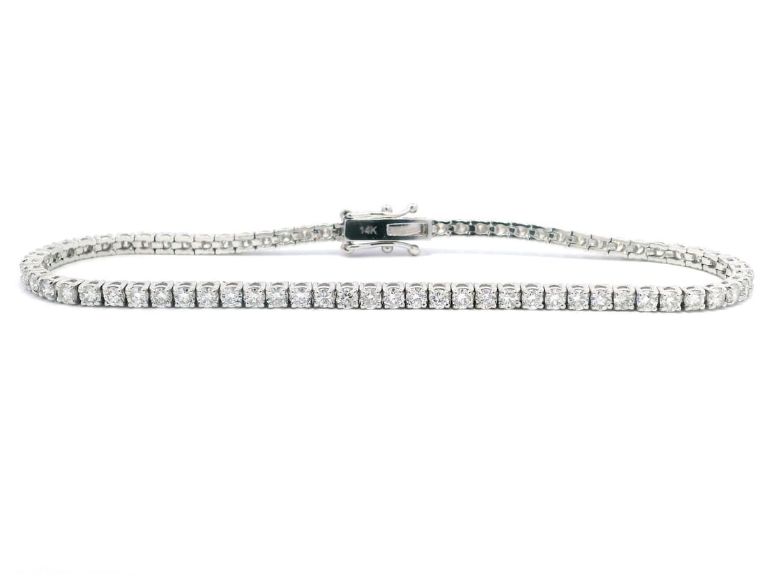 491) 14KT White Gold 3.04 ctw Diamond Tennis Bracelet: One electronically tested 14KT white gold lady's combination cast & assembled fashion straight line tennis bracelet with a tongue clasp with double foldover safeties with a basket motif with a bright 