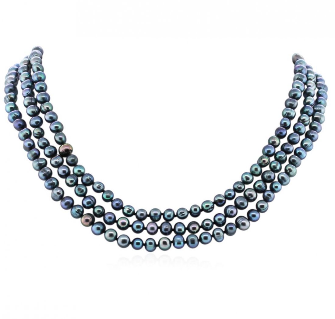 6.5-7.5MM Dark Coral Pearl Necklace: One dark coral pearl necklace approximately 60" long. The pearls measure approximately 6.5-7.5mm. Good condition.
