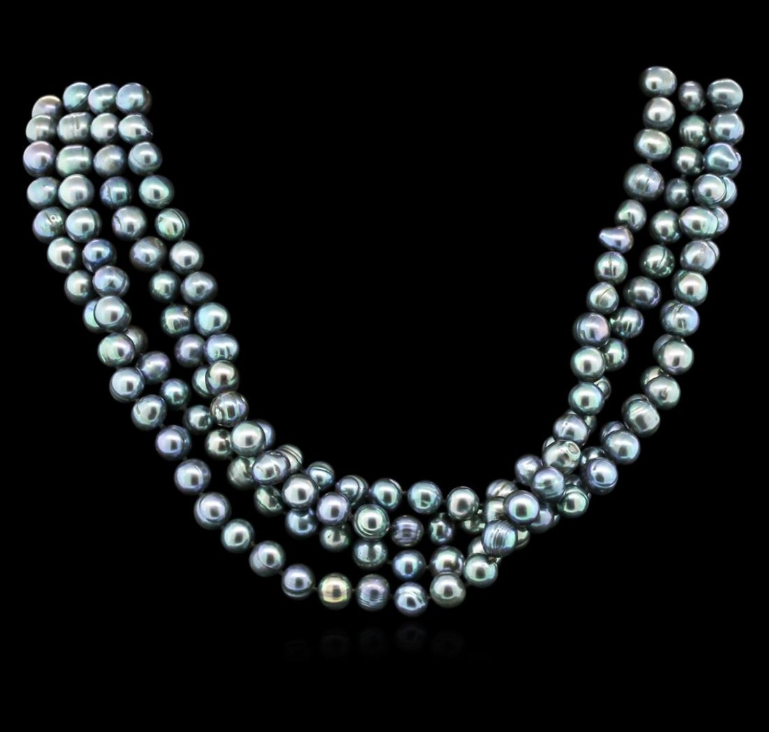 6.5-7.5MM Dark Coral Pearl Necklace: One dark coral pearl necklace approximately 60" long. The pearls measure approximately 6.5-7.5mm. Good condition.