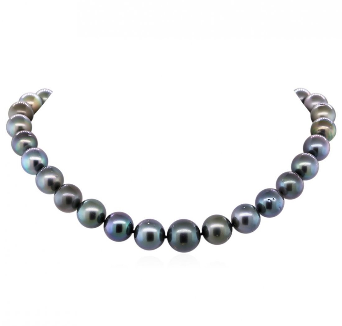 14KT White Gold 12mm-15.5mm Tahitian Cultured Black: One graduated single strand pearl necklace 17.5" princess length, knotted with a 14KT white gold 11mm ball clasp containing 31 Tahitian pearls, 12.0mm in size to 15.5mm in size. The pearls are black i