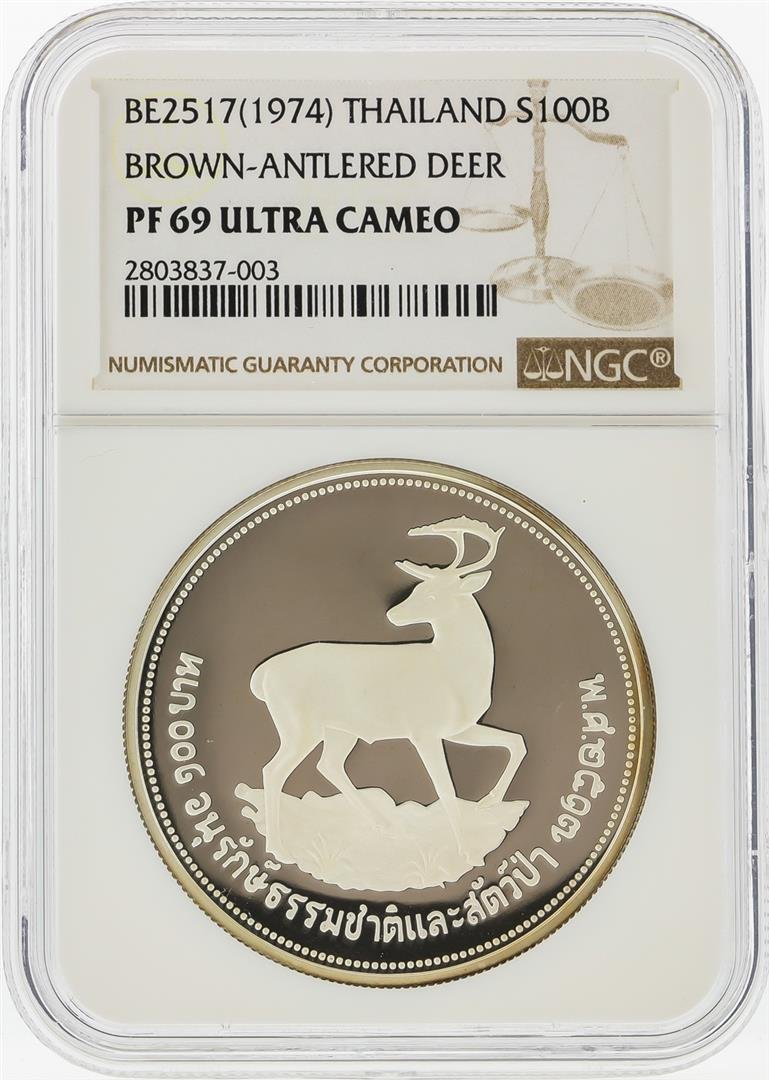 1974 100 Baht Thailand Silver Borwn-Antlered Deer Coin: One 1974 100 Baht Thailand Silver Borwn-Antlered Deer Coin NGC PF69 Ultra Cameo. NGC Certified.