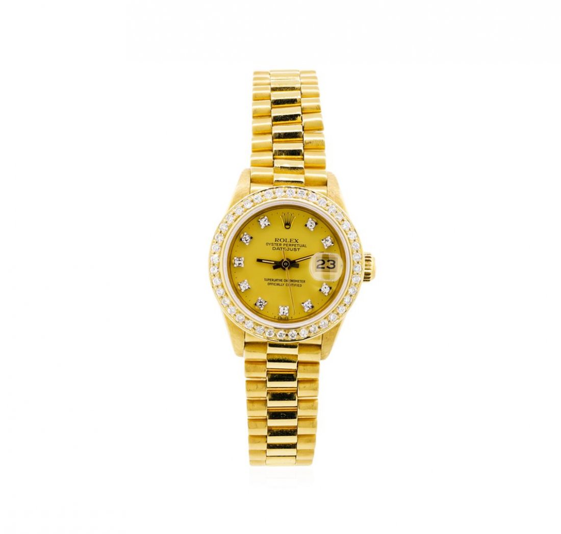 Ladies 18KT Yellow Gold Rolex President Watch with: One ladies, hand crafted & machine milled Rolex Lady President the DateJust model wristwatch electronically tested 18KT yellow gold, Circa: 1983, Swiss Hallmarked Case: 26mm oyster, Crown: twinlock wi