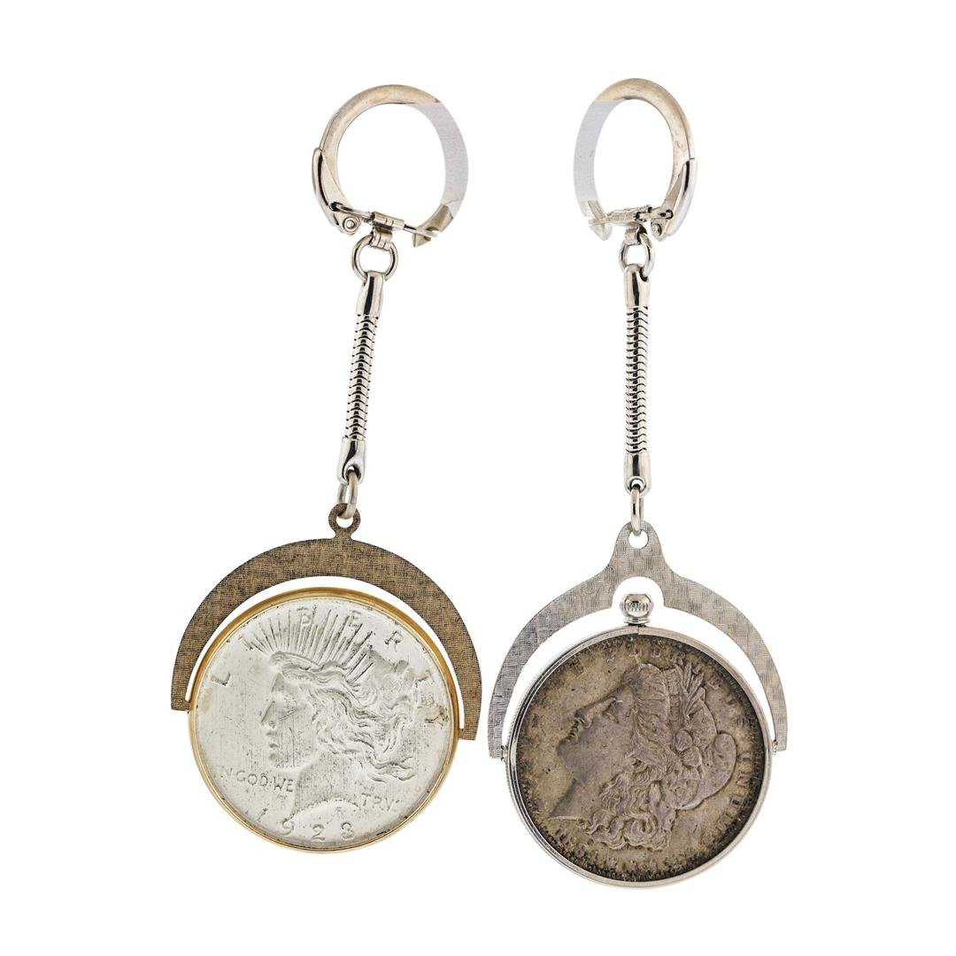 1884 $1 Morgan Silver Dollar and 1923 Peace Silver: One 1884 $1 Morgan Silver Dollar and 1923 Peace Silver Dollar Keychains.