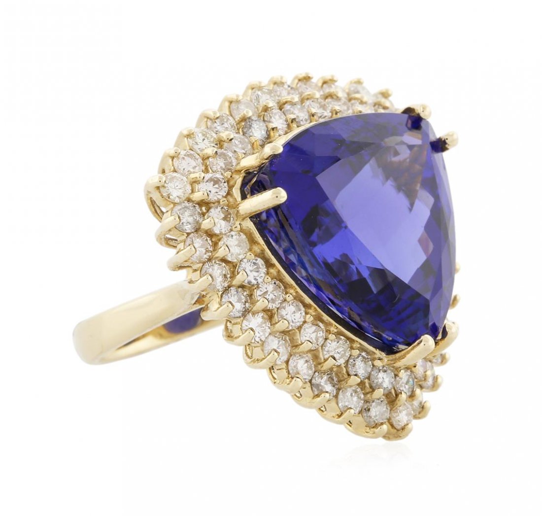 14KT Yellow Gold 21.69ct GIA Cert Tanzanite and Diamond: One electronically tested 14KT yellow gold ladies cast tanzanite and diamond ring with a bright polish finish. Condition is new, good workmanship. The featured tanzanite is set within a two tiered dia