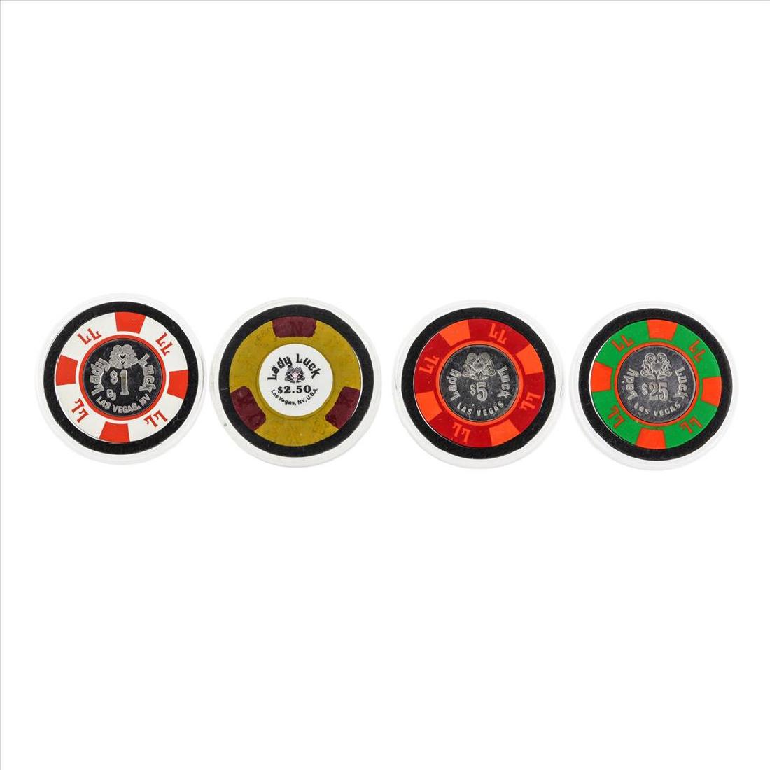 Set of (4) Lady Luck Casino Chips: One Set of (4) Lady Luck Casino Chips.