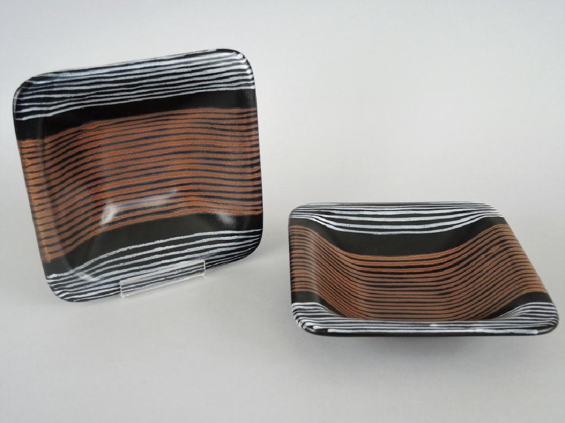 PAIR OF GLIDDEN POTTERY GLAZED DISHES: Mid 20th century, Alfred N.Y. Designed by Fong Chow. Afrikaans design. 1 3/4 x 8 x 8 in. (4.5 x 20.25 x 20.25 cm.)