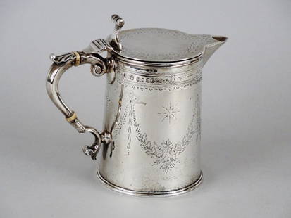 VICTORIAN STERLING SILVER COVERED JUG: London, 1875 marks for Henry William Curry. Later decoration. H: 5 1/2 in. (14.0 cm.) 350 g. (12.35 oz.)