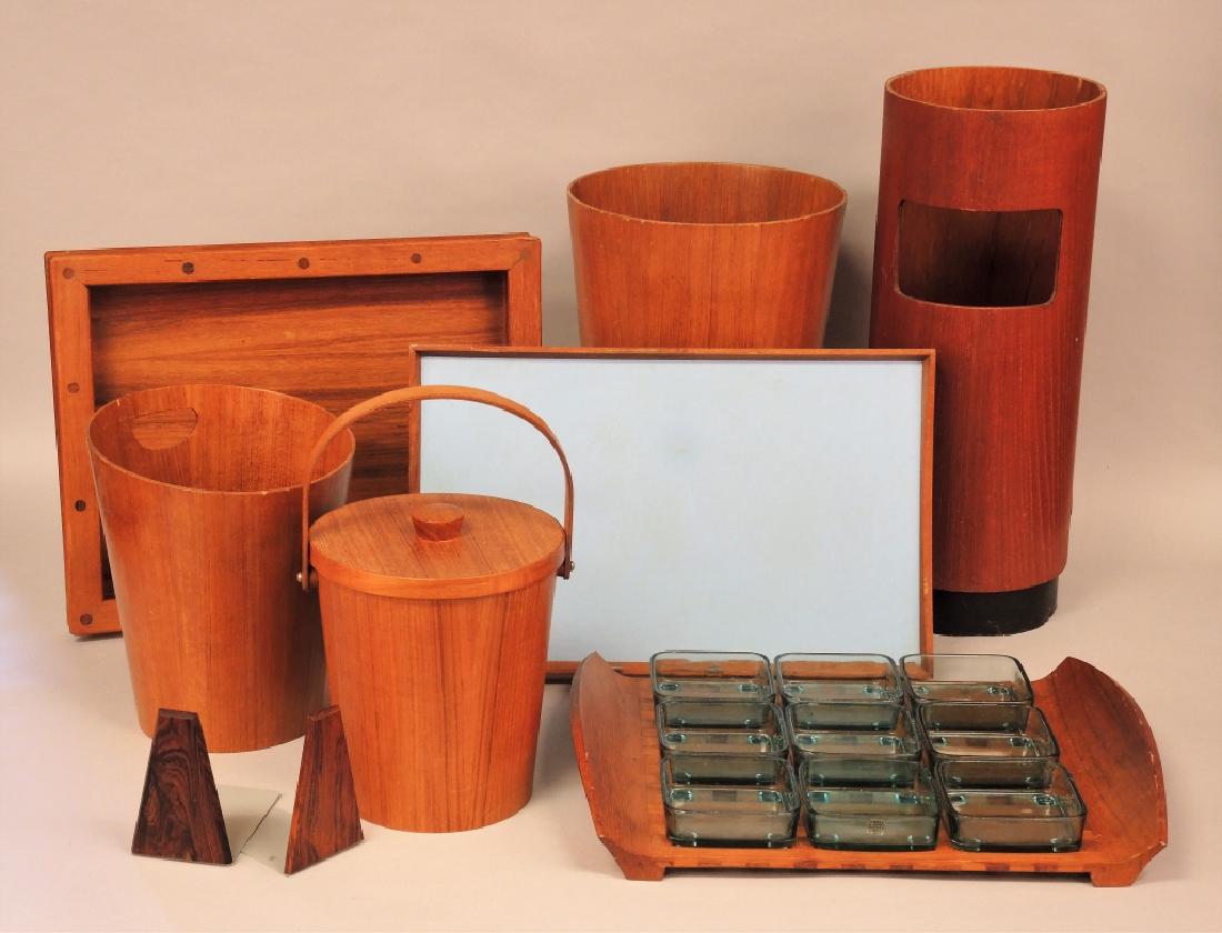 COLLECTION OF MID-CENTURY TEAK HOUSEWARES: Teak umbrella stand (Walter Depping Montreal), teak waste bin (Sweden), teak ice bucket with aluminum (Japan), teak trays (Dansk) & ( Torben Orskov, Finn Juhl) Condition appropriate to age
