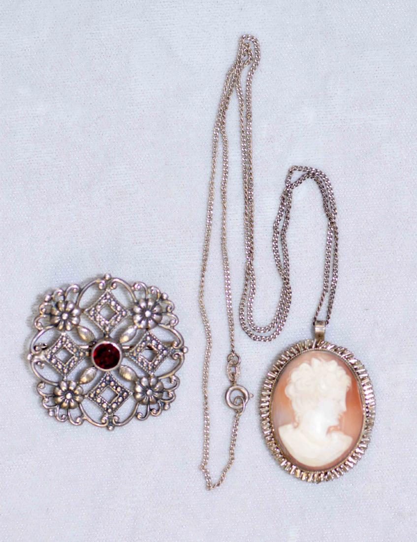 (2) ANTIQUE BROOCHES - Cameo with chain, marked 800 and (1 of 5)