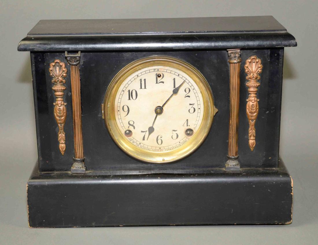 8-DAY SESSIONS MANTLE CLOCK - Forestville Connecticut,: 8-DAY SESSIONS MANTLE CLOCK - Forestville Connecticut, black lacquer with brass ormolu, tag on back; Measures: 10.25''h x 13.5''W x 5.25''D - Condition: Age appropriate wear; All items sold as is.