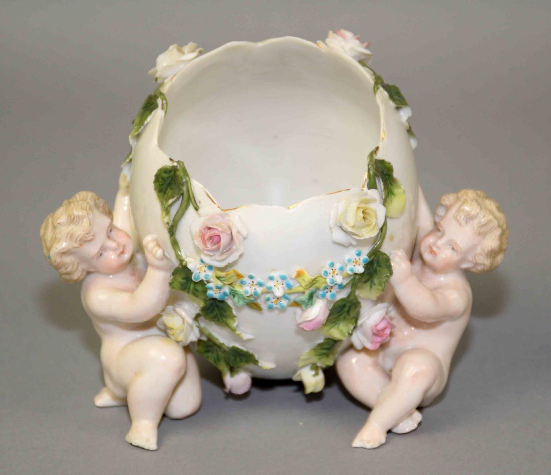 19th CENTURY SITZENDORF PORCELAIN EGG VASE - with putti: 19th CENTURY SITZENDORF PORCELAIN EGG VASE - with putti and applied floral and leaf decor; Measures: 4''H x 5''W