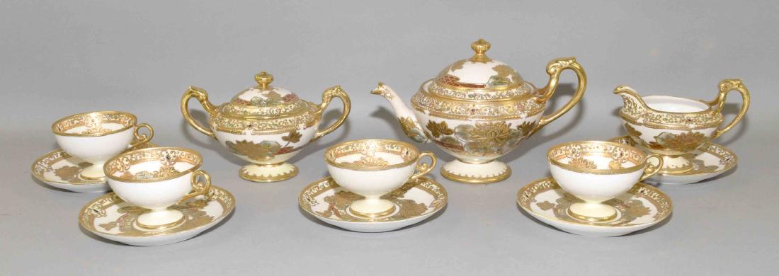 12pcs NIPPON TEA SET - White with heavy gold gilt decor;: 12pcs NIPPON TEA SET - White with heavy gold gilt decor; includes tapot, cream & sugar, (4) cups with underplates - Condition: Wear to gilt, one cut & saucer set is cracked