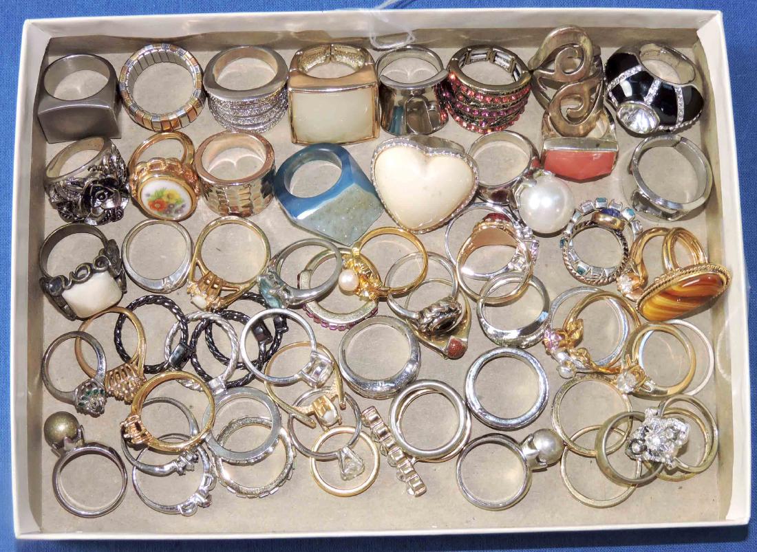 (50+) MISC. COCKTAIL RINGS. Gold and silver metals, (1 of 3)