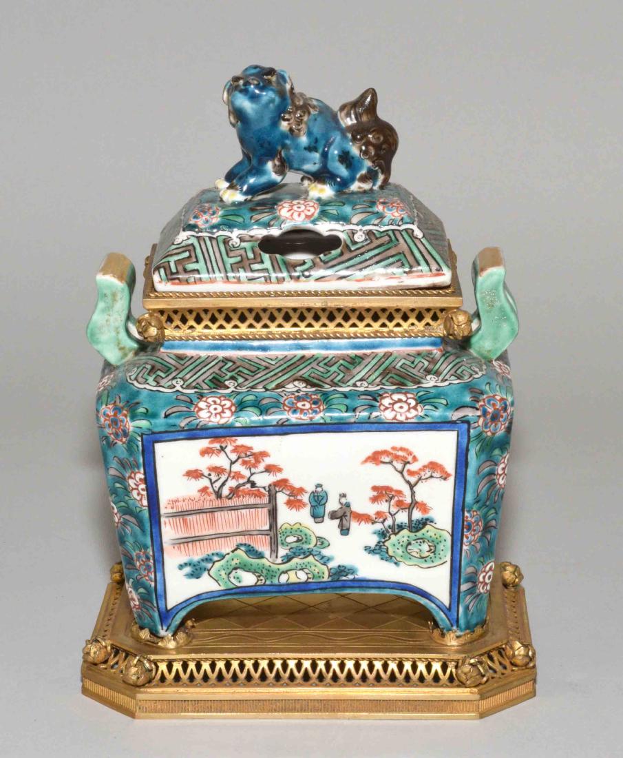 JAPANESE PORCELAIN INCENSE BURNER W/BRASS MOUNTS. 19th: JAPANESE PORCELAIN INCENSE BURNER W/BRASS MOUNTS. 19th C. 7.50''H x 5.50''W. Provenance: Mail Pouch Tobacco Estate.