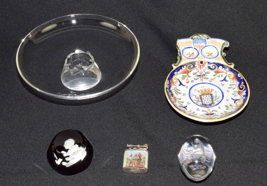 GROUP OF (5) DECORATIVE OBJECTS, comprising: Steuben: GROUP OF (5) DECORATIVE OBJECTS, comprising: Steuben tazza, 2.25''H x 8'' diameter. Guingamp faience dish, 7.50''long. Dunhill silver lighter enameled w/a fox hunting scene. Baccarat sulphide paperwei