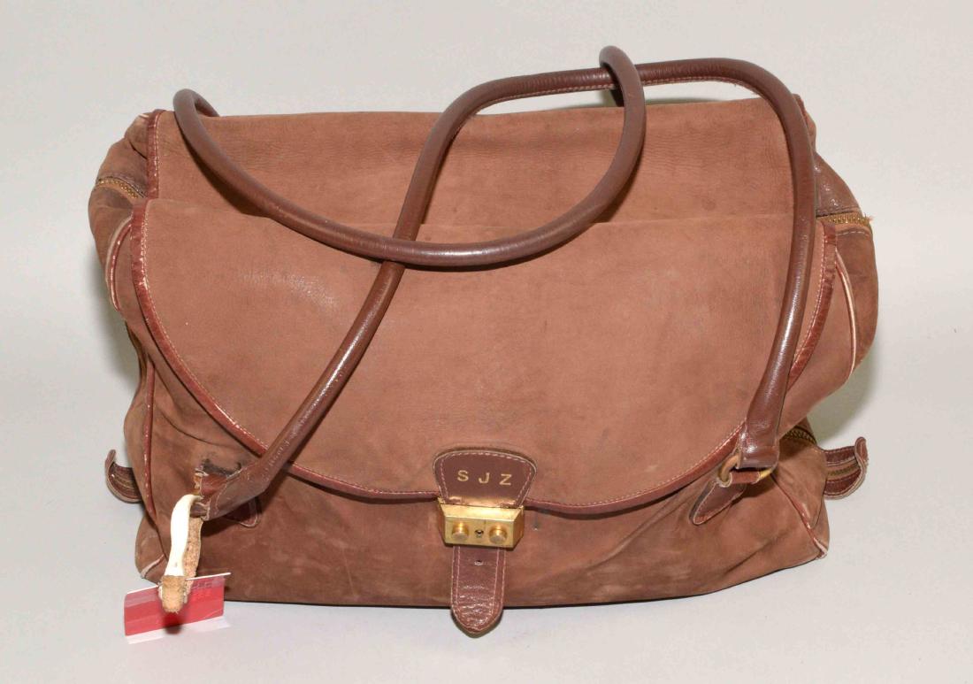 LEATHER SHEEP SKIN TRAVEL BAG WITH A GOLD LOCK and: LEATHER SHEEP SKIN TRAVEL BAG WITH A GOLD LOCK and monogrammed SJZ. The bag was purchased from Morabito in Paris. Provenance: Mail Pouch Tobacco Estate.