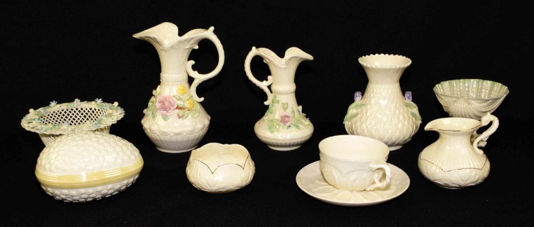 (9) MISCELLANEOUS BELLEEK IRELAND BONE CHINA PIECES.: (9) MISCELLANEOUS BELLEEK IRELAND BONE CHINA PIECES. Includes tea and saucer (1870), egg, sugar and creamer, cardium on coral. Floral; round basket, vase, and (2) Aberdeen pitchers. Largest pitcher -
