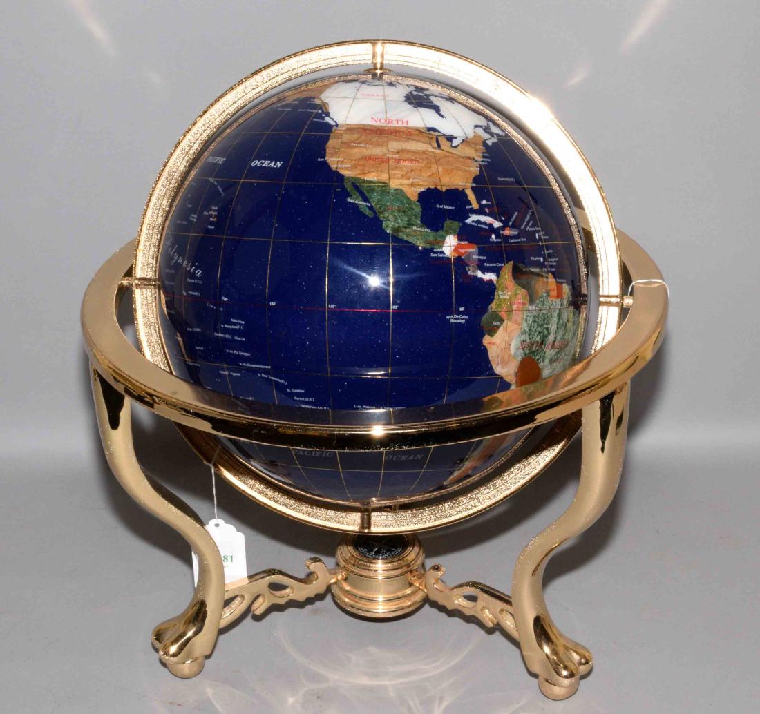 GLOBE MADE OF COLORFUL HARDSTONE ON BRASS BASE, with: GLOBE MADE OF COLORFUL HARDSTONE ON BRASS BASE, with compass. 19''H x 12'' diameter.