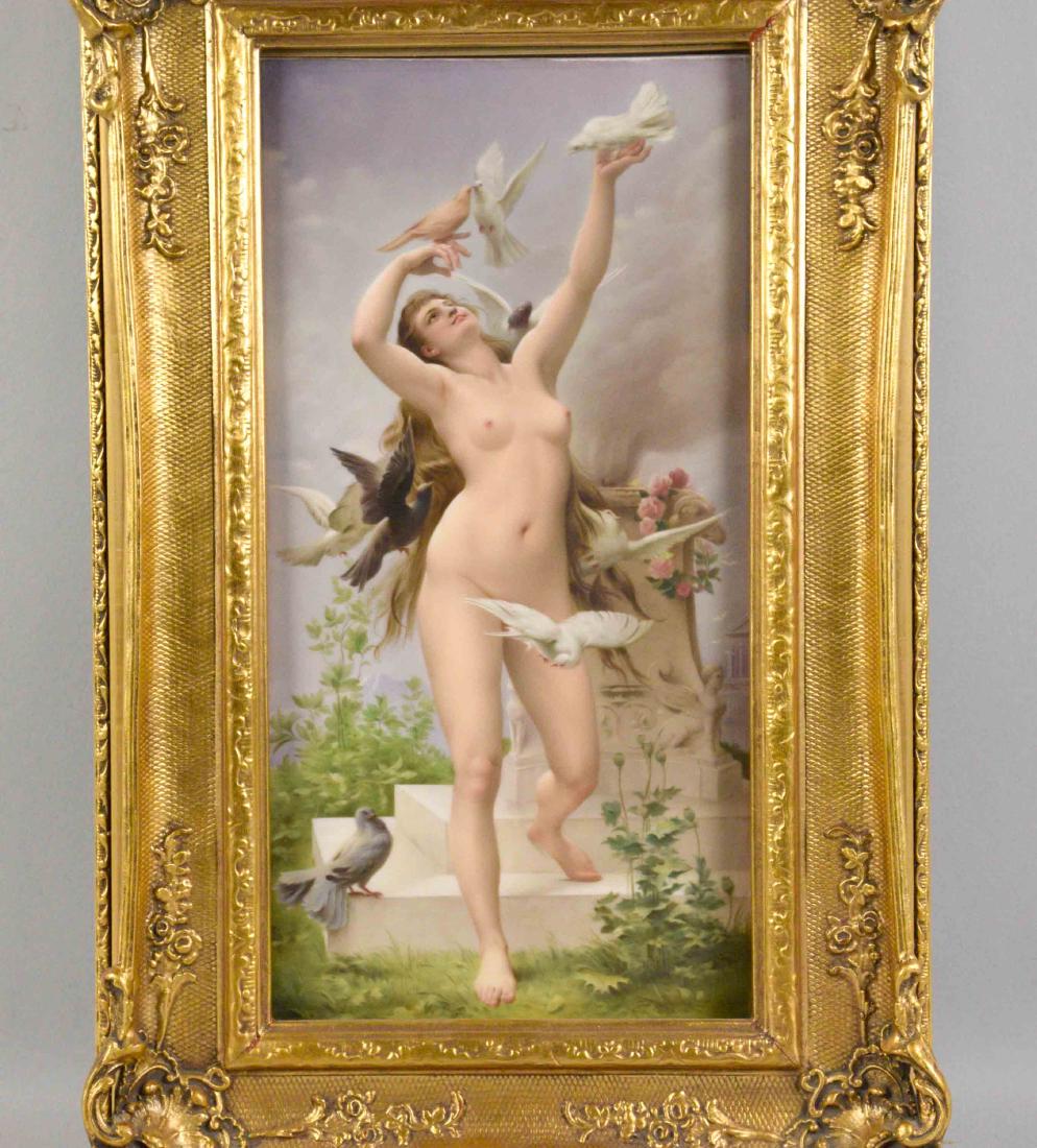 KPM PLAQUE DEPICTING A NUDE LADY WITH BIRDS. On verso: KPM PLAQUE DEPICTING A NUDE LADY WITH BIRDS. On verso ''Cythere'' after C. Sonnett Hansen. Frame: 17''h x 10''w. Plaque: 12.5''h x 6.375''w.