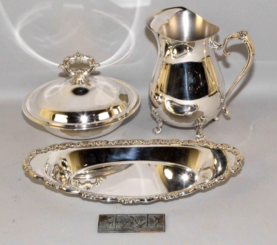 MISC. METAL DECORATIVE OBJECTS IN SILVERPLATE AND: MISC. METAL DECORATIVE OBJECTS IN SILVERPLATE AND COPPER. Includes (1) Les Potiers ''Tournage Pots'' copper stamp. (3) Silverplate serving dishes - reticulated tray, lidded bowl, water pitcher.