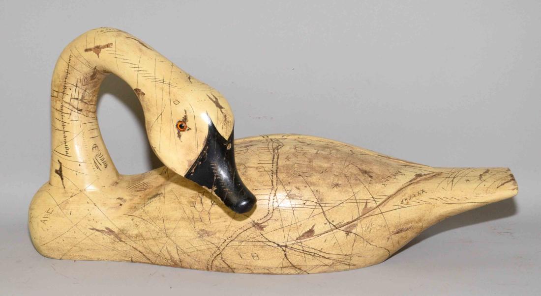 CARVED WOOD SWAN WITH GLASS EYES. Signed ABE. 9''H x: CARVED WOOD SWAN WITH GLASS EYES. Signed ABE. 9''H x 18''W.
