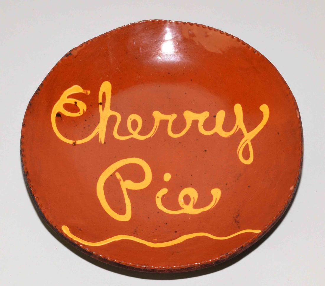 ANTIQUE REDWARE PLATE, ''Cherry Pie''. 10.5'' diameter. (1 of 2)
