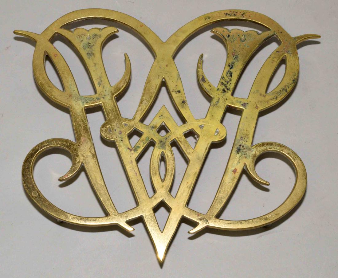 BRASS WILLIAMSBURG QUEEN ANNE CYPHER TRIVET. Copyright