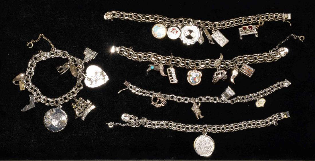 (5) ASST. VINTAGE ELCO STERLING DOUBLE LINK CHARM: (5) ASST. VINTAGE ELCO STERLING DOUBLE LINK CHARM BRACELETS, w/slide and safety clasp. Includes a variety of charms w/various stone or enamel accents. Total weight 4.6 ozt.