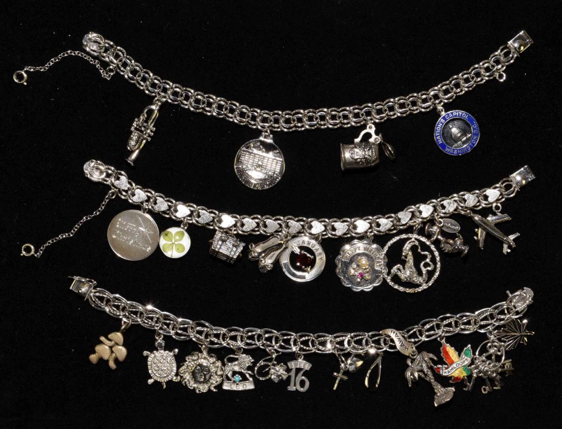 (3) ASST. VINTAGE FORSTNER STERLING CHARM BRACELETS:: (3) ASST. VINTAGE FORSTNER STERLING CHARM BRACELETS: (2) double link and (1) triple link. All w/slide and safety clasps. Each includes sterling and other decorative charms.